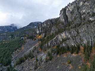 Fototapeta premium Autumn Mountain Cliff and Forest Valley in British Columbia, Canada with Pine Trees