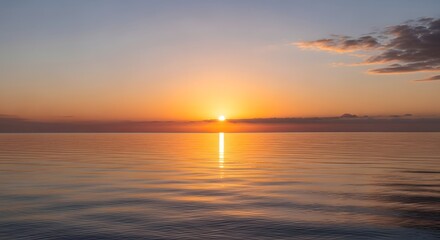 A serene sunset over a calm body of water with vibrant colors illuminating the sky and reflecting on the surface, creating a peaceful and picturesque scene