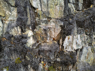 Rugged Rock Wall Texture With Cracks and Lichen for Natural Stone Backgrounds and Decor Images