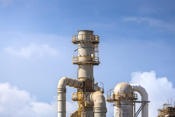 oil refinery petrochemical plant oil gas and energy production with flare stack smoke pollution emission, chemical and polymer production engineering technology for climate change control efficiency