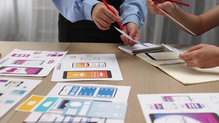 Panorama video of startup company employee planning on user interface prototype for mobile application or website in office. UX UI designer brainstorm designing user friendly interface plan. Synergic