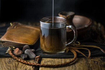 A close-up of coffee being poured into milk
