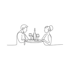 Couple enjoying a romantic dinner with wine