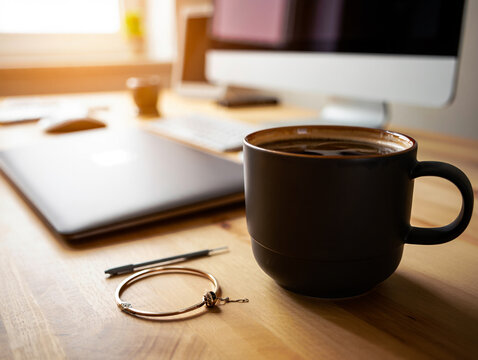 Modern workspace with coffee and digital devices for remote work success and productivity focus on comfort