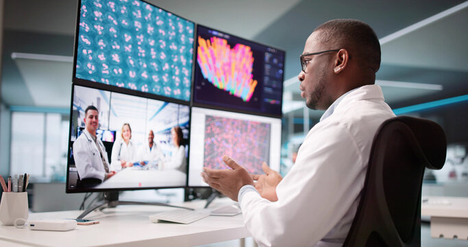 Doctors Conducting A Team Meeting Via Video Conference