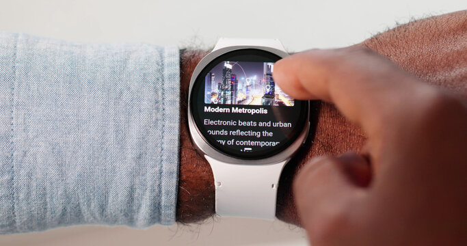 Young African American Man Browsing Smartwatch Workout Playlist - Powered by Adobe