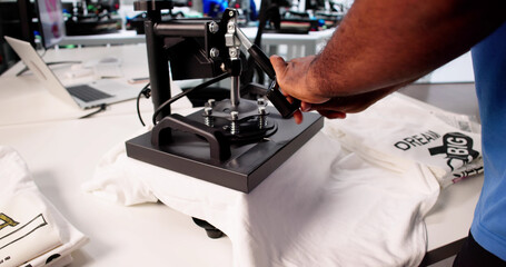 Custom T-Shirt Printing Workshop: Young Man Demonstrates Heat