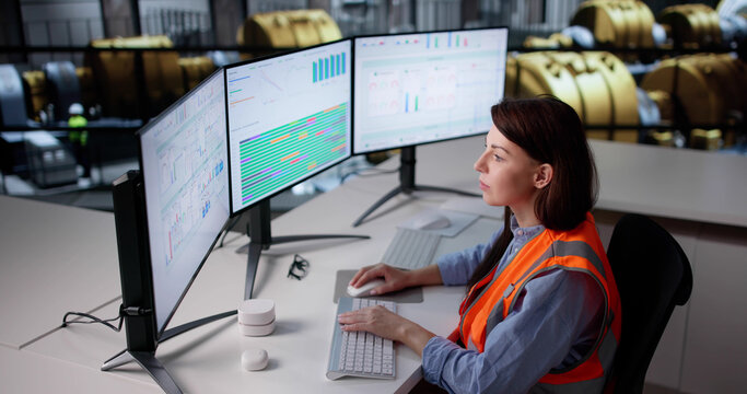 Skilled Woman Monitors Gas Turbine Engine At Oil Plant