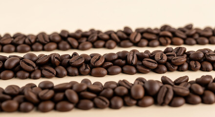Obraz premium Rows of roasted coffee beans on a light background.