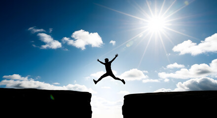 Silhouette of man jumping over gap with bright sun shining above