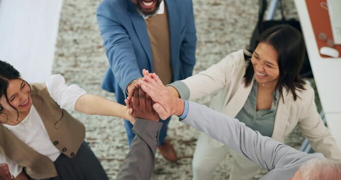 Above, business people and huddle in office with success for company objective, goal or target. Happy team, hands together or celebration in workplace with collaboration, group solidarity or synergy.