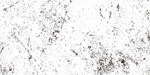 Rough grainy grunge texture featuring distressed speckles and various black particles are surrounding the white background, faded details, and raw vintage surface perfect for edgy design projects.
