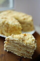 Delicious layers of cake with a creamy texture displayed on a wooden surface