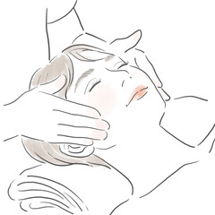 フェイスマッサージを受けている若い女性