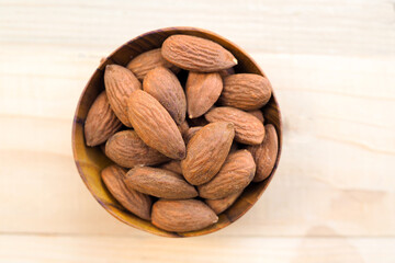 Roasted Almond Nuts in a Wooden Bowl, Top View