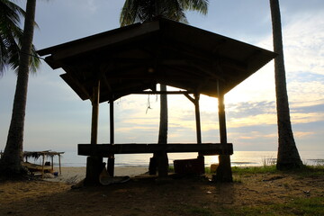 Wooden Hut by the Beach in Sunrise