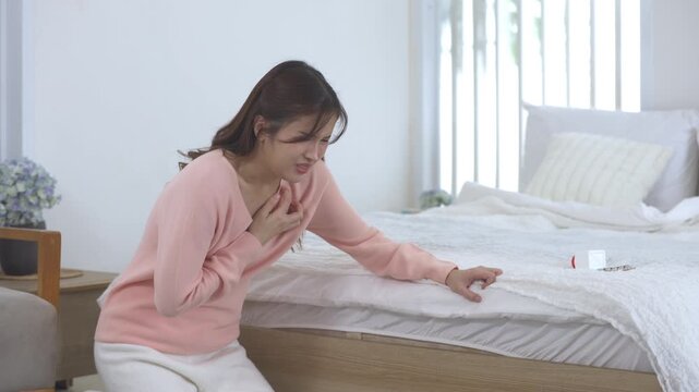 Female experiencing severe nausea, vomiting symptom sickness, morning distress with chest discomfort, breathing difficulty near bed