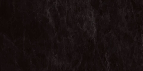 High resolution texture of a very dark nearly black slate or marble stone surface It features subtle veining and a rugged, weathered.