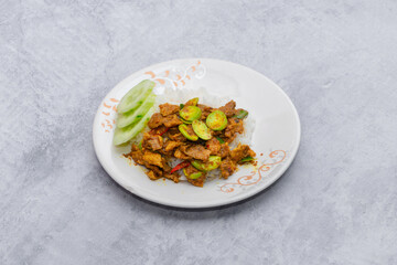 Thai food stir fried with spicy curry paste With different kinds of meat topped on cooked rice