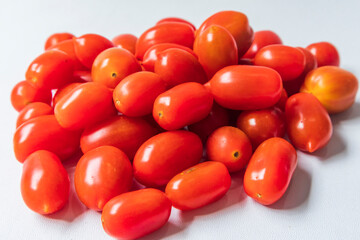 Bunch of San Marzano tomatoes. Whole plum cherry juicy tomato. Italian fresh vegetables. Organic raw vegan healthy food vegetable. Farm market product.  macro, studio