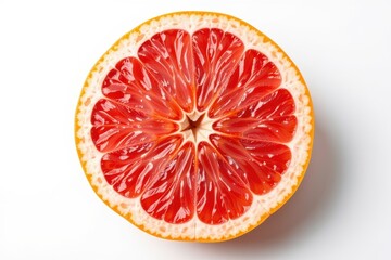Top-down view of halved red grapefruit showing juicy segments and vibrant citrus texture on clean background.