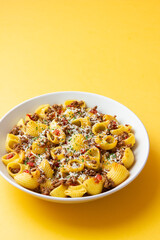 Pasta with bolognese sauce and cheese. Italian cuisine. Traditional recipe.