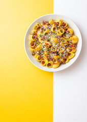 Pasta with bolognese sauce and cheese. Italian cuisine. Traditional recipe.