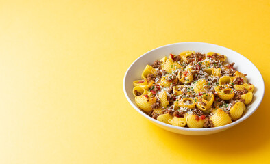 Pasta with bolognese sauce and cheese. Italian cuisine. Traditional recipe.