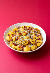 Pasta with bolognese sauce and cheese. Italian cuisine. Traditional recipe.