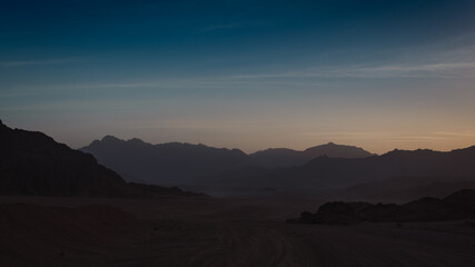 rocky mountains and desert landscape and sunset sky in Egypt