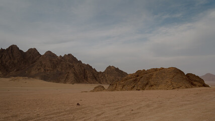 rocky mountains and desert landscape and sunset sky in Egypt
