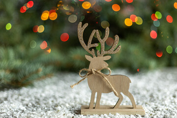 Wooden reindeer decoration with colorful bokeh