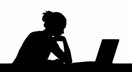 Silhouette of a woman intently working on a laptop.