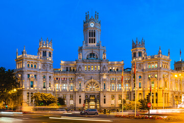 Facade of Cibeles Palace, Palace of Communications or Palace of Telecommunications, in Madrid, Spain at night