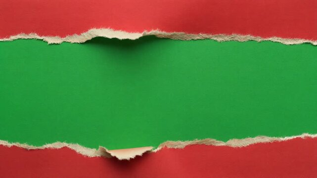 Red Paper Tearing Horizontally To Reveal Green Screen Background.