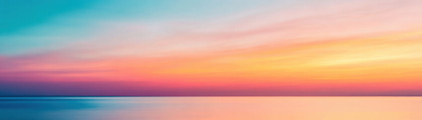 Fototapeta premium Dramatic orange and blue sky during sunset reflects on calm ocean water creating peaceful and vibrant seascape view