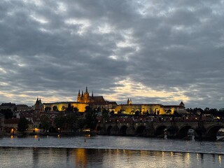 Dramatic Cloudy Sky Over Illuminated European Cityscape at Twilight