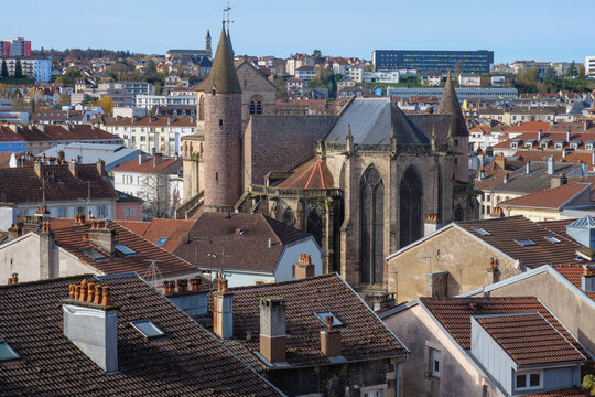 A high-quality cityscape of downtown &Eacute;pinal, located in the Vosges region of northeastern France. The image showcases the harmonious blend of historic French architecture, modern urban elements