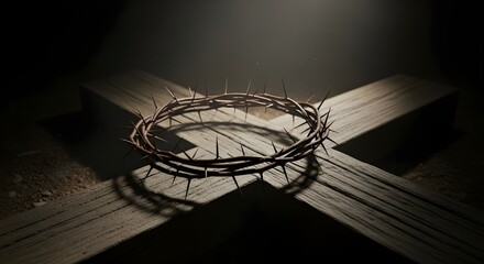 Crown of thorns resting on a wooden cross in a dimly lit environment