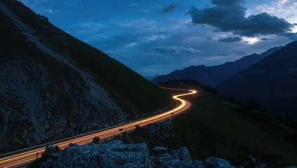Traffic flow on the Transfagarasan pass at night, showcasing urban density and mountain road intricacies