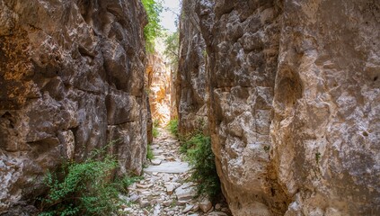 Fototapeta premium Sarakina Gorge in Crete, a narrow and scenic trail through rugged terrain, perfect for exploration and adventure seekers