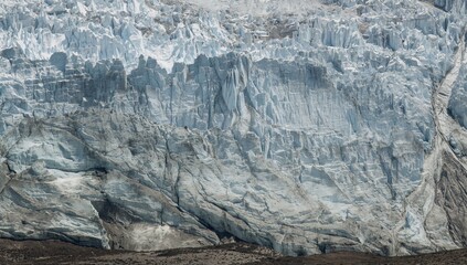 Fototapeta premium A breathtaking view of glacial formations on a rugged mountain, showcasing the strength of nature through its icy textures, Earth Day