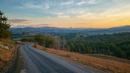 Old road landscape with trees and mountains, travel theme, seasonal change