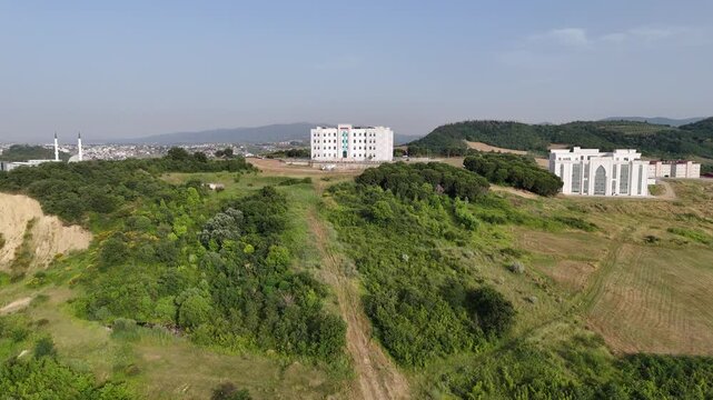 A clear view of Yalova University in Yalova, Turkey, showcasing its modern architecture and well-organized campus environment. The scene reflects contemporary educational design with clean lines, open
