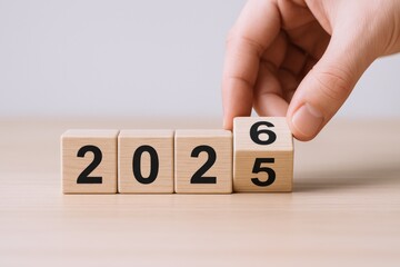 Flipping Wooden Block to Represent the Transition from 2025 to 2026 Symbolizing New Year