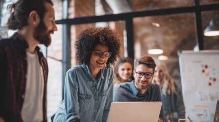 Diverse team collaborates on a project, brainstorming and discussing ideas in a modern office space