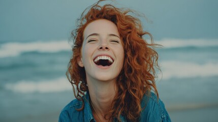 Laughing Woman with Red Hair Enjoying the Beach Breeze and Carefree Summer Day