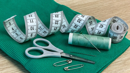 A set of handicraft tools laid out on fabric conveys the idea of ​​creativity, hobby, making...