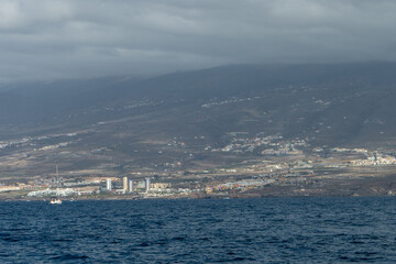 
View of southern Tenerife from a boat with coastline and tourist areas
