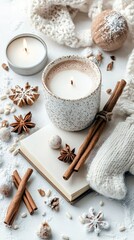 A warm and inviting winter scene featuring a mug of hot beverage, lit candles, cinnamon sticks, star anise, and cozy knitted elements.